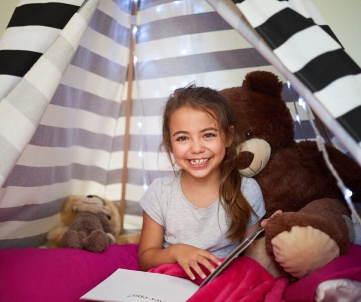 2023 Summer Reading List of Best Books For Kids -- summer reading in a cozy tent